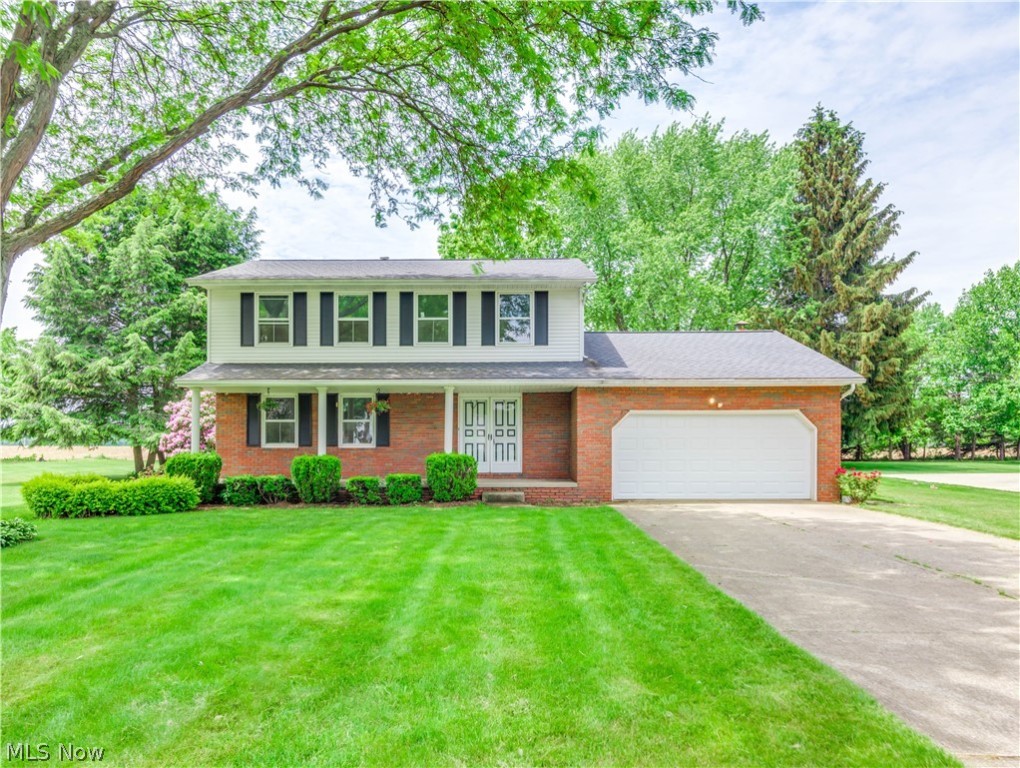 Welcome to 12071 Basswood Colonial home in Lake TWP. This lovely home sits on .50-acres, on which you can sit back on the patio & enjoy the view of the large backyard and private cornfield views, open spaces behind the property. The eat-in kitchen offers hardwood floors, appliances, a breakfast bar, and freshly painted cabinets. It opens to the family room with a brick fireplace (gas) and sliders to the backyard. There is a formal dining room, a half bath, and a living room on this floor. Upstairs the master bedroom features a full master bath with a walk-in shower. Three bedrooms and a full bath, all freshly painted, complete the upper level. Most windows have been updated and have a new garage door and opener in 2020—nice dry basement with laundry area, glass block windows. Nice 8 x 12 vinyl-sided shed for storage. Great neighborhood to raise a family and just a short walk to Uniontown Park and Lake Local Schools. Make your appointment for your private showing today!