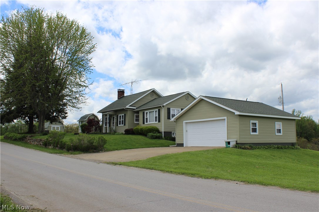 Enjoy private and quiet Country living with beautiful sunset and sunrise views. This ranch home sits on top of the hill on 4 acres. Walk into the enclosed breezeway that connects the 2 car garage to the house to enter a well taken care of home. Formal Living room has a brick wood burning fireplace and there is also a wood burner in the Family Room. There is a beautiful stone wood burning fireplace in the walkout basement that has the potential for its own living quarters being equipped with its own kitchen. With two full baths and three bedrooms, this home is ready for you to put your personal touch on it. Two outdoor sheds complete this perfect ranch country home. Home has baseboard electric heat but also has whole house wood burner as well. No mineral rights to transfer.