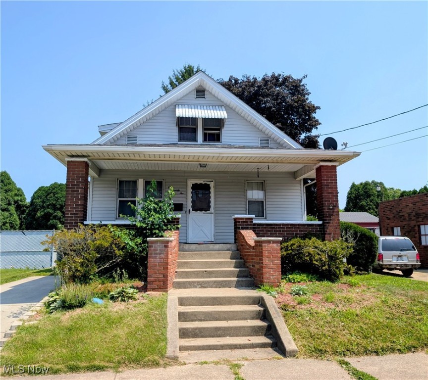 Welcome home to this charming bungalow home with fantastic potential located in the heart of desirable Minerva! This wonderful home features 3 bedrooms, 1.5 bathrooms, and is nestled near the heart of downtown Minerva. Perfectly located within nearby distance to local shops, dining, and other amenities, this home offers both convenience and charm. As you enter inside from the impressive front covered porch, you will find a traditional layout, featuring a spacious living room, formal dining area, and a large functional kitchen, with ample cabinetry and counter space. The main floor includes one bedroom and a convenient half bath, while upstairs you’ll find the two additional bedrooms and a full bathroom. Enjoy your morning coffee or evening unwind on the covered rear porch overlooking a private backyard—perfect for relaxing, gardening, or entertaining. With solid bones and great layout, this home offers an excellent opportunity for cosmetic updates to truly make it your own. Call today for your private showing while this one lasts!