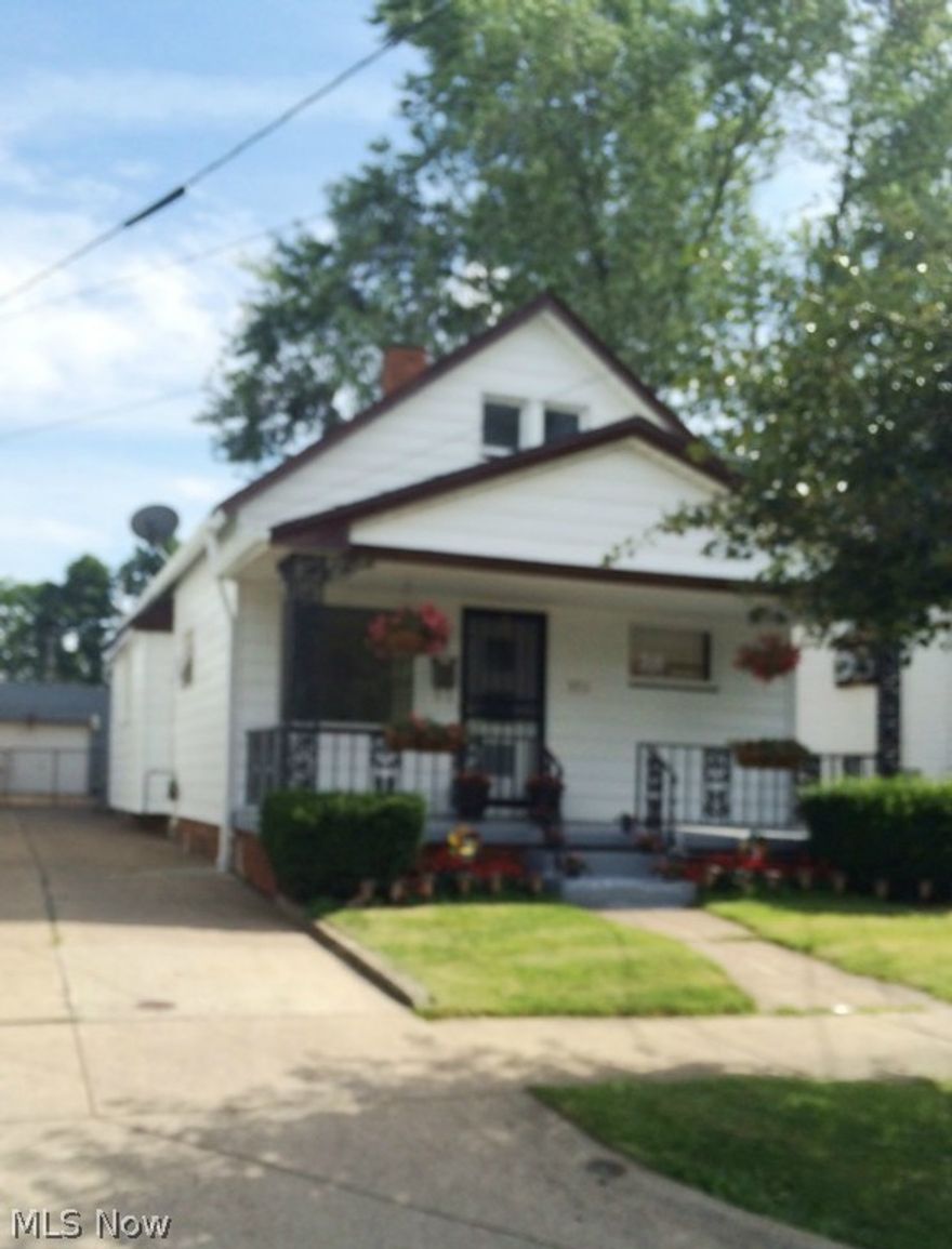 Cute doll house. Well cared for with updates: newer roof with complete tear off and new plywood '03; newer garage door with opener; newer 80% plus efficiency Bryant  furnace; new hot water heater '12; and three newer steel security doors. There also is a rec room with summer kitchen; central air; a security system; double oven; hardwood floors; and a covered patio with private, fenced yard.