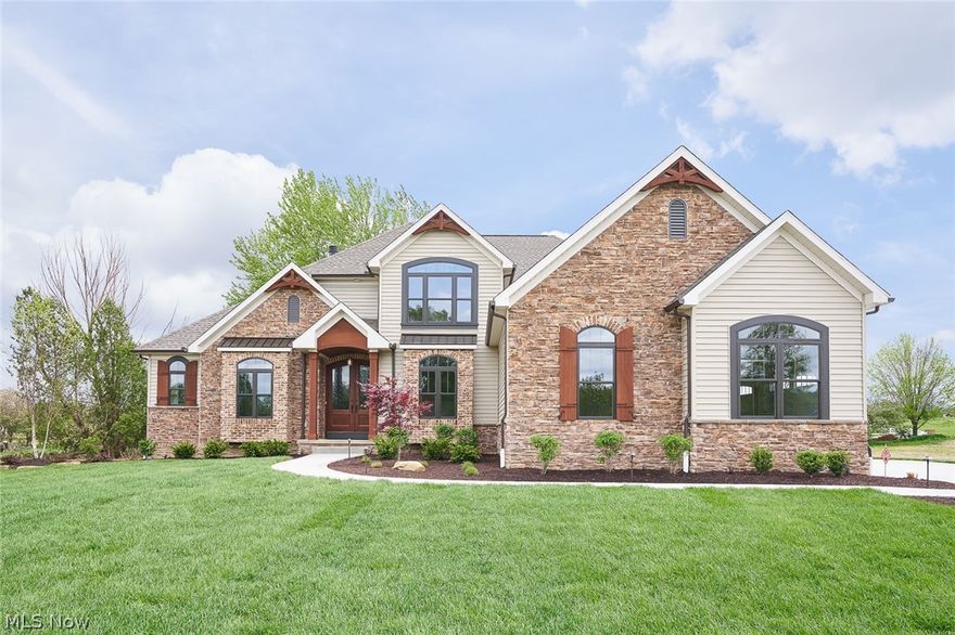 Located in Rolling Green Estates! Beautiful home built from VictoryGate Custom Homes.   This home is over 4000 sq. ft of living space including finished basement.  So many custom amenities such as barrel ceiling in foyer, wainscoting in Dining Room and loft area.  Crown and beams throughout the home.  Curved entry ways and rounded windows. Ship lap and built-ins and a custom wine area in the kitchen.   This is a first floor master with 3 bedrooms up with a jr. suite.  The basement is complete with a game room area, bath, kitchen and a wine room.  This is a must see home!