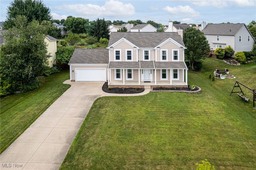 Step into this beautifully maintained 4-bedroom Colonial located in the desirable Wintergreen community of Wadsworth. Nestled on a generously sized .30-acre lot with inviting curb appeal, this home offers the perfect balance of space, updates, and warmth. The welcoming 2-story layout features over 2,100 sq ft of finished living space including a bright living room with a cozy gas fireplace, a formal dining room perfect for entertaining, and a fully applianced kitchen with granite countertops, breakfast bar, and ceramic tile floors. The adjacent eat-in area opens to the backyard for easy indoor-outdoor living. Upstairs, the vaulted primary suite boasts a spacious layout, walk-in closet, and en en suite with double sinks and a soaking tub. Three additional bedrooms with ample closet space share a large full bath. The first-floor laundry room adds everyday convenience. Enjoy summer evenings on the covered front porch or deck overlooking the spacious backyard. Transform the full unfinished basement into your dream recreation or media space. This quiet location is just a short distance to schools, YMCA, and parks! Major updates include sump pump-2019, windows, A/C-2021, hot water tank, roof-2025!