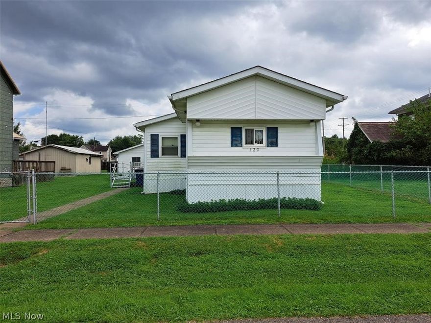 Don't pass up the opportunity to own this well maintained 1972 Holly Park mobile home! Enter the home through the nice 6x24 sunroom into a large living room with 7x11 extension and coat closet. The eat-in size kitchen/dining area has many cabinets, a built-in buffet and pantry closet. The 2 bedrooms offer double closets with the master bedroom having built-in dressers and desk/vanity area. The full bath with newer walk-in shower also houses the washer and dryer. A rear exit door allows for a future side deck if desired. There's also a great 2-car garage with alley access and garage door opener. A flat 50x120 lot is  completely fenced for your pets or children. The wheel-chair ramp is an extra but can be removed. Newer hot water tank, gas forced air, central air. Must be owner occupied per Village Ordinance. Reasonable living, so schedule your tour today!