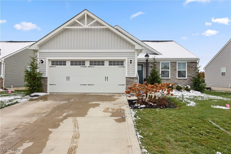 Ranch-style living with modern flair in desirable Grafton/Eaton Twp! This open-concept home features many builder upgrades, including a bright kitchen with quartz countertops, center island, and plenty of cabinet space. Easy-care LVP flooring flows through the main living areas, with cozy carpet in the bedrooms. The well-sized secondary bedrooms are serviced by a full bath, while the spacious primary suite offers a large walk-in shower, double vanity, and generous closet space. The unfinished lower level, with plumbing rough-in for a future bath, mirrors the square footage of the main floor and offers amazing potential for additional living space. Enjoy abundant natural light, recessed lighting throughout, and a covered deck that extends your living space outdoors. Maintenance-free living means more time to relax and enjoy your home. Why wait to build when this move-in-ready ranch is available now? Make your move and celebrate the holidays in your new home!