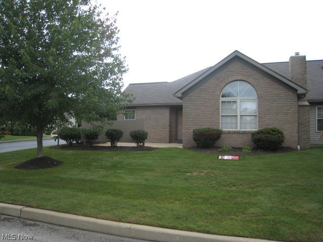 Decorator perfect! Just place your furniture and move right in. Tastefully remodeled and improved 2 BR 2 bath condo overlooking the golf course. The cathedral ceiling great room has arched window and gas fireplace. Dining area and breakfast bar opens to the kitchen with beautiful corian solid surface counter tops, glass backsplash and stainless appliances make entertaining easy. Spacious master bedroom, with walk-in closet and full bath, readily accomodates king size furniture. The second bedroom features a wall of closets. The main bath has a step in shower .Convenient first floor laundry and attached 2 car garage /opener and water has a wall of cabinets and pull down stairs for storage. Private patio. too. Quick possession.