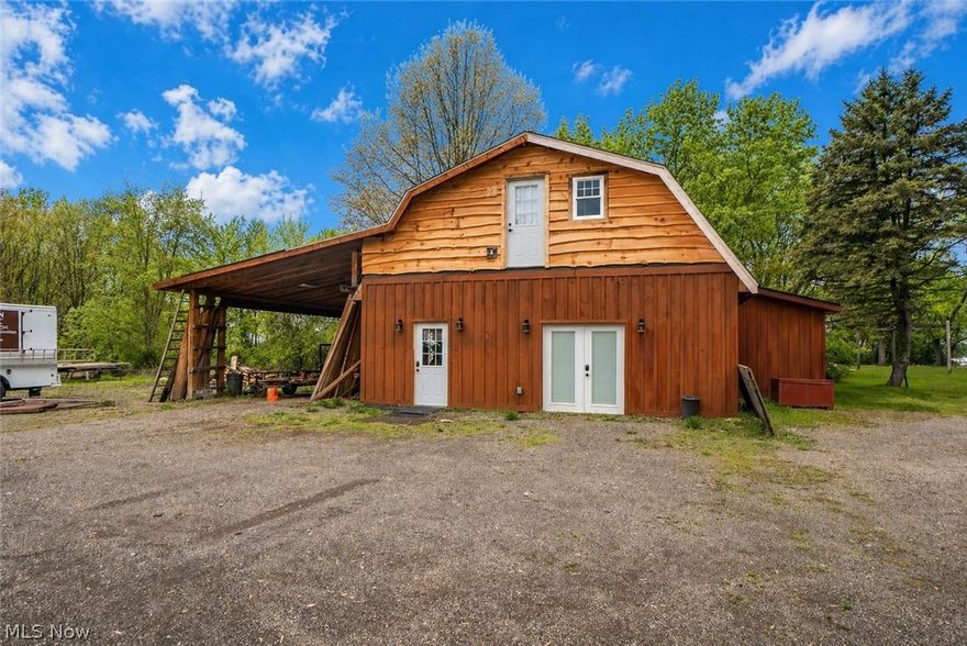 Rare income-producing opportunity on over 2 acres in a convenient Massillon location. The highlight of this unique property is a spacious, remodeled barndominium offering exceptional rental or owner-occupant potential. Featuring soaring ceilings and versatile living space, the open-concept main level includes a large living area with a wood-burning stove, an eat-in kitchen with custom details and stainless steel appliances, and a half bath. The upper level offers additional bedrooms, a full bath, loft space, and access to an upper deck—ideal for enjoying the surrounding open land. An additional single-family home on the property provides a second rental opportunity, featuring a comfortable living room, eat-in kitchen with ample cabinetry, and two bedrooms sharing a full bath. Outdoor amenities include covered patio areas and plenty of usable land. With multiple income-producing structures on one parcel, this property offers excellent flexibility and strong investment potential. Don't miss this once in a lifetime investment opportunity!
