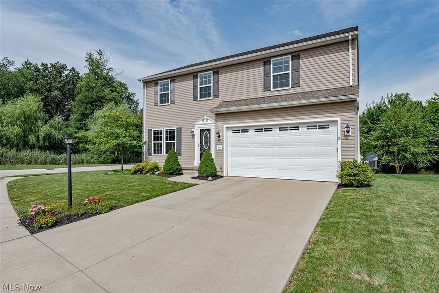 Move right in to this like-new colonial in Reminderville! This delightful home provides 2,200 square feet of living space with a welcoming floorplan, a spacious owner's suite, and a beautiful back patio. The kitchen is the heart of the home, and includes an island, a full complement of appliances, and a sunny dining area with sliders to the backyard. Off of the kitchen, there is a cozy family room with a fireplace. A half bathroom and an office complete the first floor. Upstairs, you will find four bedrooms and two full bathrooms, including the owner's suite. The owner's suite has a large walk-in closet and an en-suite bathroom with two sinks and a step-in shower. The full lower level provides plenty of additional room for storage, and it could easily be finished to provide additional living space. It has garden level windows and plumbing for another bathroom. Outside, the back patio and gas firepit make this home perfect for outdoor entertaining, plus evergreen trees line the backyard