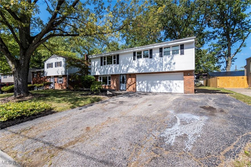 Beautifully remodeled and updated 3 bedroom, 2.5 bath home that is move-in ready. Living room has an accent wall of the electric fireplace and is open to the formal dining room and updated kitchen with stainless steel appliances. Lower level features a spacious family room with sliders leading to the back yard.