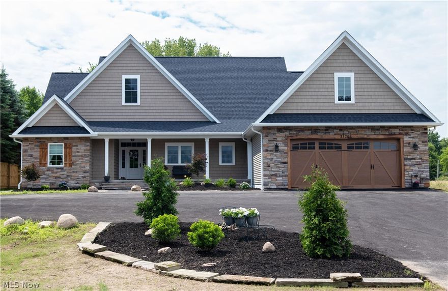 Experience a rare piece of country in the city! This brand new 2,905 square foot custom-built farmhouse ranch provides the beauty and serenity of country living with all the features of a modern luxury home. This 3 bedroom, 3 full bath home is located on a deep, partially wooded 3.5 acre property surrounded by farms. Enter from the spacious front porch to find a breathtaking, hardwood-floored family room with a stone hearth fireplace, high-vaulted rough sawn panel ceiling and wood beams. The open floor plan leads you to the modern kitchen – fully custom built with upgraded appliances and granite counter tops. The master suite is an escape, featuring tray ceilings with stepped crown moulding, custom accent lighting, and a private bath with his & her sinks, quartz counter tops, freestanding pedestal tub and a spacious walk-in shower. Extra wide hallways lead to the additional bedrooms and baths, a large first-floor laundry room, and access to the deep 2.5 car garage. Incredible views awa