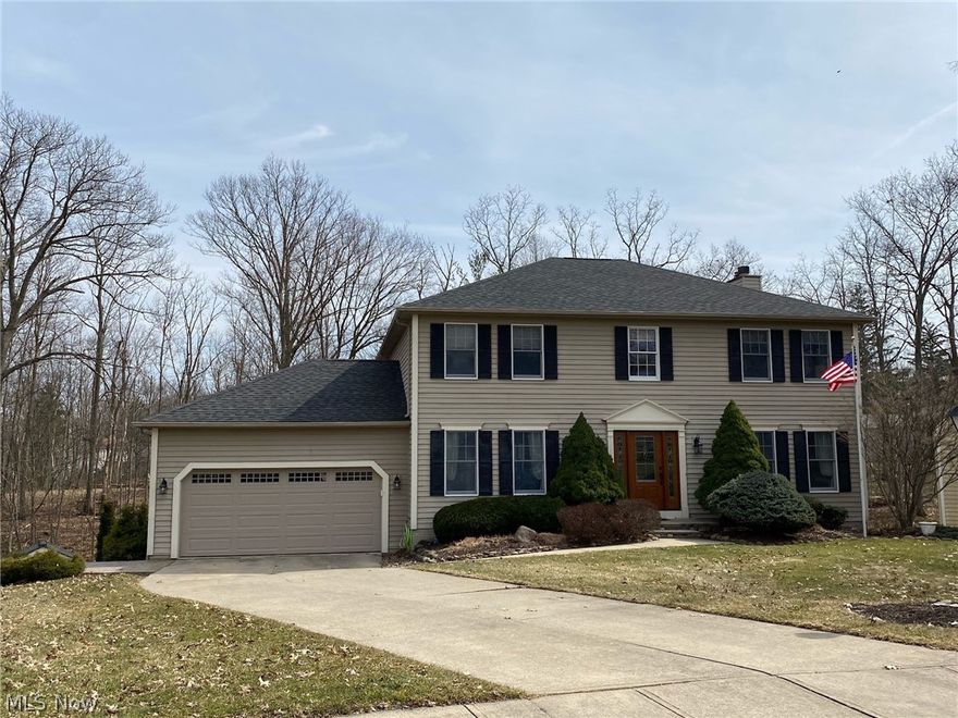 Your home search is over.  This beautiful 4 bedroom colonial located in the Spyglass subdivision of North Royalton is perfect for you. The home is located on Tanglewood Dr at the end of a cul-de-sac. If you like to be outside in privacy this home has it all. The wooded backyard has a beautiful deck off of the kitchen that leads to a stamped patio and walkout basement. The patio has stairs off the driveway leading all of your friends to your summer retreat.  When entering the home, the spacious two story foyer greets guests with hardwood flooring guiding you to an open family room with wood burning fireplace and wet bar. The wooded view is pure relaxation. The kitchen features a large island and plenty of storage. Hardwood flooring is throughout the living room and dining room. The center staircase takes you to the upstairs where you will find four large bedrooms and two full bath. The walkout basement is finished to create your workout area or indoor entertaining.