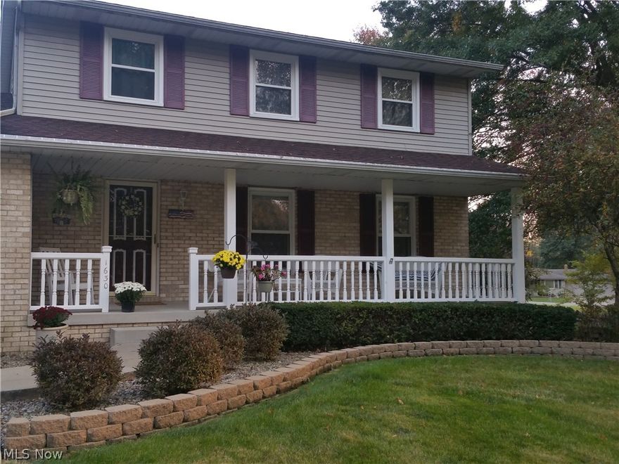 Mineral Ridge location. Welcome home to this beautiful 3 bedroom colonial house. Brick and vinyl on the front of the house with a front porch, concrete flooring with electrical outlet, sit back & enjoy your home!  Roof is 5 years old, new windows on 2nd level upstairs, updated kitchen, newer counter tops and back-splash, gas stove, microwave, dishwasher, oven, range, refrigerator, and plenty of cabinets. The family room has a wood burning fireplace and the dining room features hardwood floors. upstairs has 3 bedrooms, the master has it's own full bath and extra closets. The lower level features a full, finished basement with rec. room, wet bar, bar-top, stools, dancefloor, and lots of extra storage.  This area is great for hosting parties.  New Patio doors lead you to a huge deck and above-ground pool in the backyard.  Schedule a showing today!