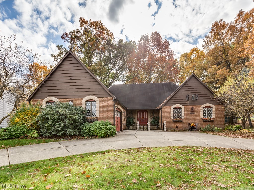 Lovely English cottage cape cod with so much character & charm offering 4 bedrooms (3 on 1st floor), 2.5 baths, 3104SF plus 850SF in finished lower level* Double door entry with beveled glass & ceramic floor* Outstanding vaulted great room wrapped with windows, fan & access to deck & patio* Living room with wood floor & slider to deck & pocket doors to formal dining with crown molding, built in cabinets around stone gas log fireplace & wood floor* Updated eat in kitchen with Quartz counter tops, island, pantry, crown, engineered wood floor, access to back yard and fully appliance (Jenn air 4 burner plus griddle burner top, double built in ovens, Bosch dishwasher, disposal & new microwave)* 1st floor laundry with cupboards, shelves & counter space* 3 bedrooms with fans & guest bath on first floor* 2nd floor beamed cathedral master with skylight, sitting area with slider to balcony, his & hers walk in closets, master bath with sky light, double vanity, separate shower & jetted tub* Hug