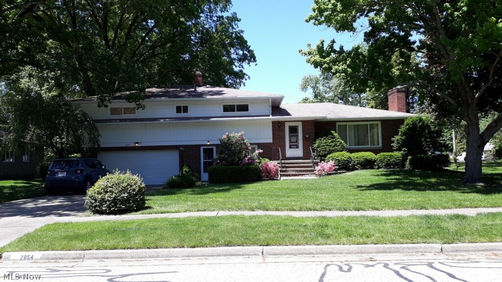 This wonderful home is waiting for your personal touches! A four level split home provides a lot of space. You will enjoy the fireplace in the living room and convenient access to the formal dining room and eat in kitchen. The ground level family room provides a separate cozy atmosphere with a second fireplace and walk out to the patio. All four spacious bedrooms are on the second level. There are hardwood floors under all the carpet. Let's not forget the finished basement!
It has a charming bar area and plenty of storage. There is a full bath and laundry area in the basement as well. The 2 car garage is attached for your convenience!