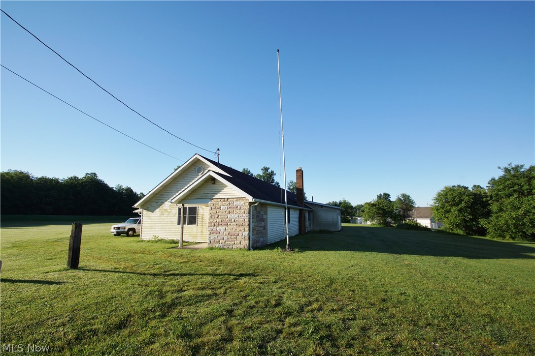 4.99 Acres - Value is in the land. Zoned R-3. There is a 3,310 Sf Building on the property that was a former club house/lodge. Large kitchen, meeting area and two restrooms. Covered patio and an attached one-car garage. Located on a dead end street.