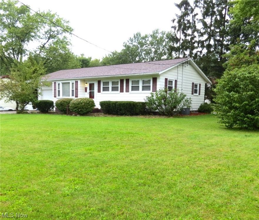 Wecome to this updated & meticulously maintained 3 bedroom ranch home, situated on a generous corner lot w fruit trees! As you step inside you'll immediately notice the stunning hardwood flooring that flows throughout the main living areas, creating an inviting, timeless atmosphere. The large living room offers ample space for gatherings & features an entry closet. The kitchen boasts newer laminate flooring, providing both style & durability for your culinary adventures, appliances stay for your convenience. The main hallway provides attic access & leads to a full bath & 3 bedrooms w ample closet space & ceiling fans to keep you cool. One of the highlights of this home is the expansive recreation room in the basement, complete w a convenient bar area, a perfect place for entertaining, + a 2nd refrigerator. You will also find a laundry area including washer/dryer, glas block windows, built-in shelving & lots of storage. The roof & windows were replaced in 2014 along w additional insulat