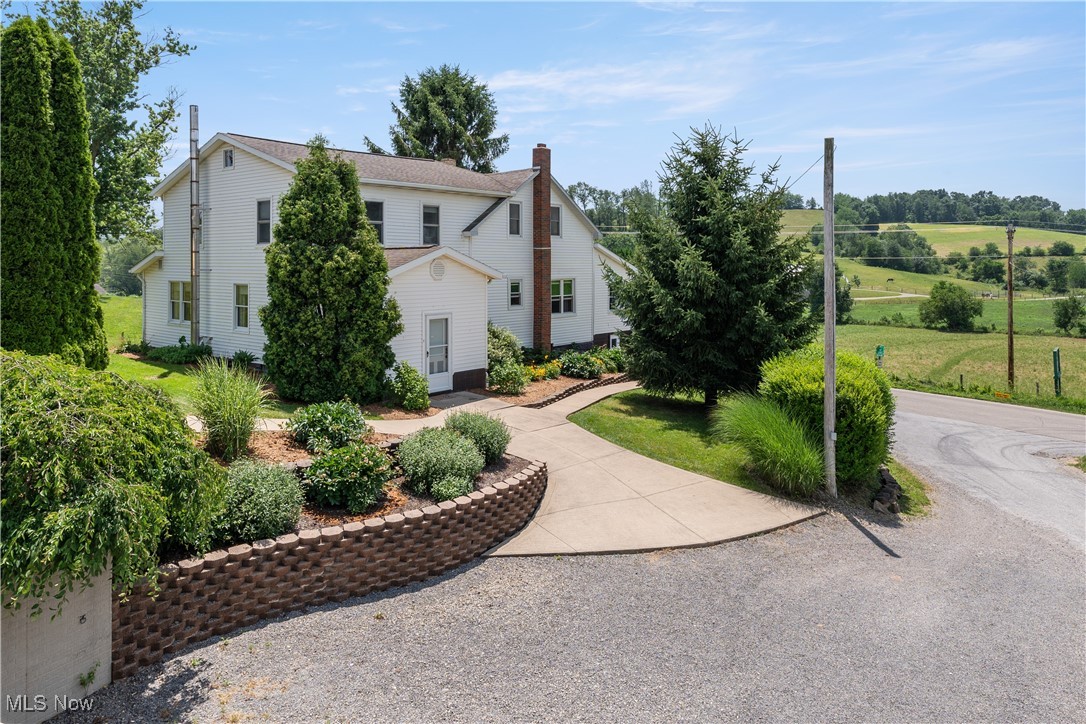Discover the charm of country living in this spacious 5-bedroom home, perfectly situated on 2.13 peaceful acres. The heart of the home is a large, open kitchen and dining area—ideal for hosting family and friends—flowing into a warm and inviting living room. The full walk-out basement includes a dedicated kitchen for the canning process and a can cellar for storing and preserving your harvest. Solar system that is currently there will convey with the property.
Step outside to enjoy the tranquil setting from the back porch, surrounded by thoughtfully landscaped grounds. The property features an established garden, a versatile shop/barn combo, a 18x20 storage shed, and a dog kennel—offering plenty of room to grow, work, or unwind. Whether you're looking for space to spread out or simply enjoy peaceful country living, this property delivers the perfect blend of comfort and functionality.