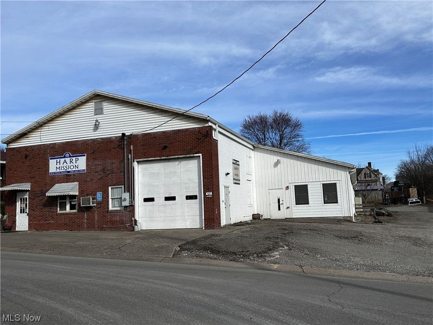 7590 SQ FT Commercial Warehouse is currently home to Helping Appalachian Rural Peoples (HARP). This commercial building is a large warehouse space with 1 full, and 2 half baths, front lobby/ office space. Additional office/ storage room space, and additional addition that has a kitchen and bunk rooms. Lots of parking available a new business.