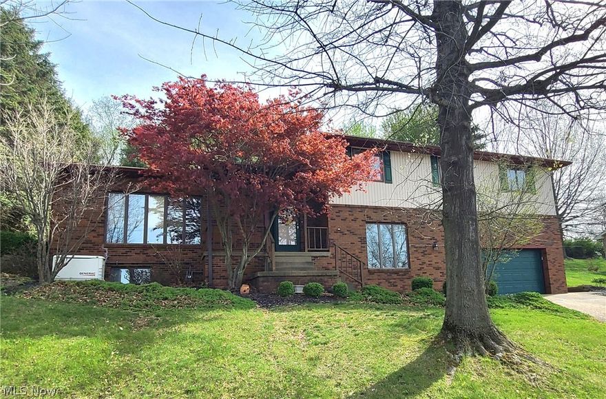 Welcome to this spacious and beautifully maintained 2,700+ square foot home located in a highly desirable St. Clairsville neighborhood! This impressive 4-bedroom, 2 ½-bath residence offers the perfect blend of comfort, functionality, and quality throughout. The remodeled kitchen is a true highlight, featuring a tile floor, stunning cabinetry, Corian countertops, and all appliances included—ideal for both everyday living and entertaining. Just off the main living space, the inviting rear sunroom provides a relaxing retreat year-round, complete with a gas heater for added comfort and an outdoor hot tub just a step away. This well-cared-for home also includes a Generac whole house generator, giving you peace of mind in any season. With generous living space and thoughtful updates, this property is ready to welcome you home!