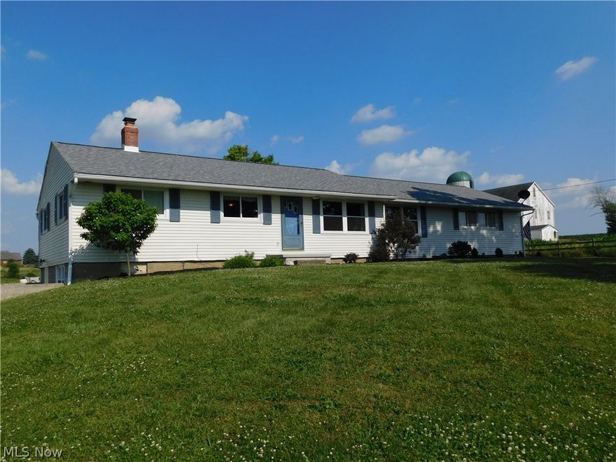 You can experience beautiful sunrise and sunsets from this 1500 Sq. Ft. Ranch located in Northwestern School District on 3 acres. 3 bedrooms 1 bath ( these is a toliet in the basement in the storage room and plenty of space to complete a 2nd full bath) open floor plan with 2 bedrooms on one side of the home and master bedroom on the other. Hardwood floors located throughout most of the home. The finished lower level family room and dining area has the availability for water ready to install your own bar or mini kitchen and walks out onto a stamped patio and brick fire pit.   The views of the countryside are amazing from the above ground pool and nice size deck with plenty of room for entertaining. Some new windows, new roof, pool installed along with new deck, stamped patio and new walkout lower level door and finished family room are a few of the updates to the home. The is a must see home.