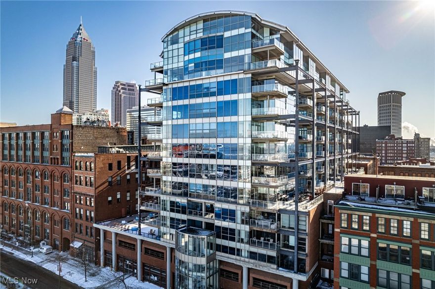 Experience elevated living in this stunning 11th-floor condo at The Pinnacle, offering breathtaking city views. This move in ready unit features floor to ceiling windows, a private balcony, hardwood flooring throughout, and an open concept layout. The kitchen offers granite countertops, modern cabinetry, and stainless steel Viking appliances. The primary suite includes a walk in steam shower and a dual sink vanity, while the second bedroom features an en-suite bath and walk in closet. Two assigned parking spaces are included. Enjoy 24-hour concierge and security, a 24/7 fitness center with yoga and sauna rooms, and a spacious common patio with grills. Walkable to dining, entertainment, and trolley access. Call your favorite Realtor today to make this yours!