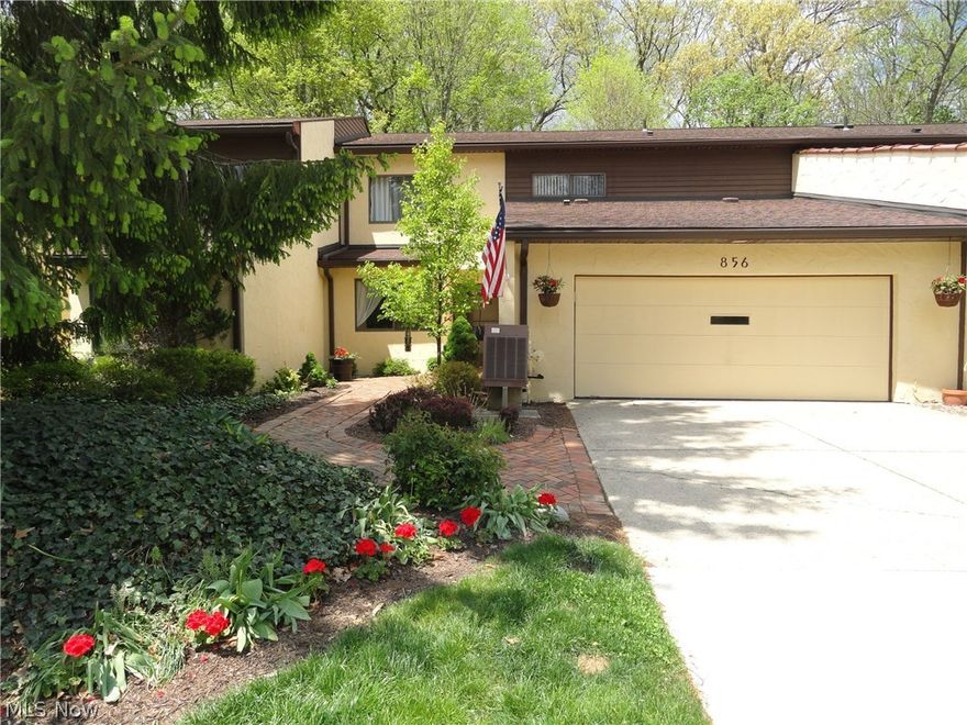 Spectacular townhome in excellent condition.  Dramatic design, open floor plan yet warm and inviting throughout.  Private setting wit a 40 ft deck overlooking the wooded ravine offering gorgeous views year round.  This townhome has vaulted ceilings, skylights, an open staircase, and windows across the back welcoming the sunlight.  Main living area has white washed cedar walls creating an urban rustic feel.  Updated eat in kitchen with walnut cabinets, granite counters and stainless appliances.  Formal dining room is open to the Great room with fireplace and wet bar.  2 spacious bedrooms plus a den or 3rd bedroom and an office.  Impressive master suite with private balcony vaulted ceiling, and master bath with dressing room.  Energy efficient with extra insulation and new furnace in 2013.  Well maintained Hampton Woods adjourns 75 acres to hike and bike or play at the Olympic size swimming pool and tennis courts.  Must see!