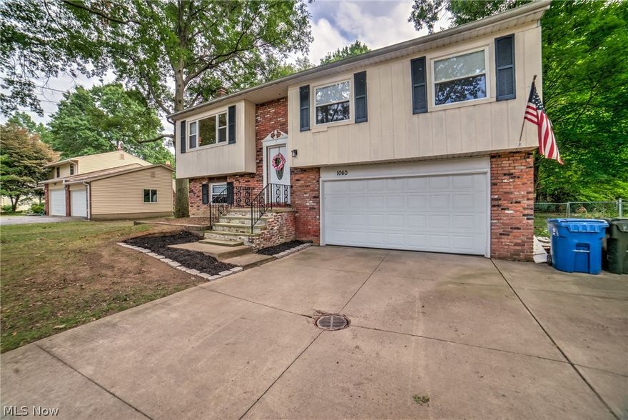 Gorgeous HGTV Gem awaits !  Meticulously maintained Bi-level has been renovated from top to bottom! First level offers an open spacious floor plan with large living room adjacent the dining area which leads to deck overlooking the near acre wooded lot. Pristine kitchen with granite counters and SS appliances. Three large bedrooms and beautiful ceramic bath complete the 1st level. The lower level has a custom fireplace and family room along with a theater area to cozy up and watch those favorite shows and movies in the cold winter months. Additional 1/2 bath, laundry/utility area complete the lower level. Attached 2 car garage. Fenced yard. All appliances included..even furniture can be negotiated. Excellent Rated Nordonia Schools. Convenient location to metroparks, Cuy Valley Natl Park, Brandywine & Boston Mills ski resorts. Easy access to I-271 and I-480.