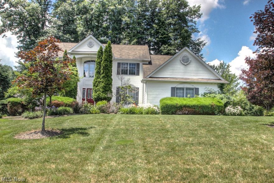 JUST REDUCED!! Located in one of Solon's most desired neighborhoods, this pristine 4+ bedroom colonial has been beautifully and tastefully updated. A 2 story foyer, gleaming hardwood floors on main level, office with built-in bookcases, gorgeous large open kitchen with sliders to deck, formal dining room with tray ceilings, open family room with fireplace and vaulted ceilings, extraordinary spacious master suite, large lower level recreation room, and lower level bonus bedroom with full bath, and the list goes on! This wonderful home is ready for you!