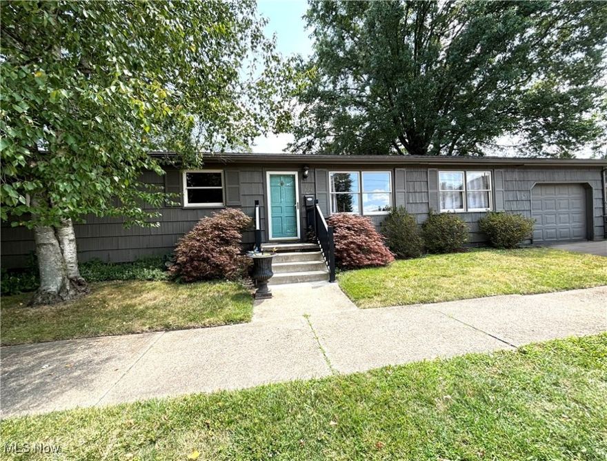 Upon entering this 3 bedroom ranch home, you are greeted by a spacious and open living area featuring a cozy fireplace that serves as a focal point. This area seamlessly flows with the dining area and kitchen, creating a space perfect for family gatherings and entertaining. The large windows flood the space with natural light, creating an airy and inviting atmosphere. The private fenced backyard features a newly constructed deck, perfect for outdoor dining, barbecues, or simply relaxing.  Kitchen includes stove, refrigerator, and dishwasher. Three bedrooms and bath complete the living space. The home has been professionally deep cleaned, carpets, windows, walls, kitchen, ensuring a move-in-ready condition.  The open floor plan, cozy fireplace, renovated basement, and new deck provide a versatile environment suited to a variety of lifestyles. The home features a newly installed electric breaker box, new GFCI outlets, and a totally waterproofed basement.  Roof shingles 2016. There is also a 1 car attached garage. Great location near downtown Columbiana, shopping, restaurants, churches.