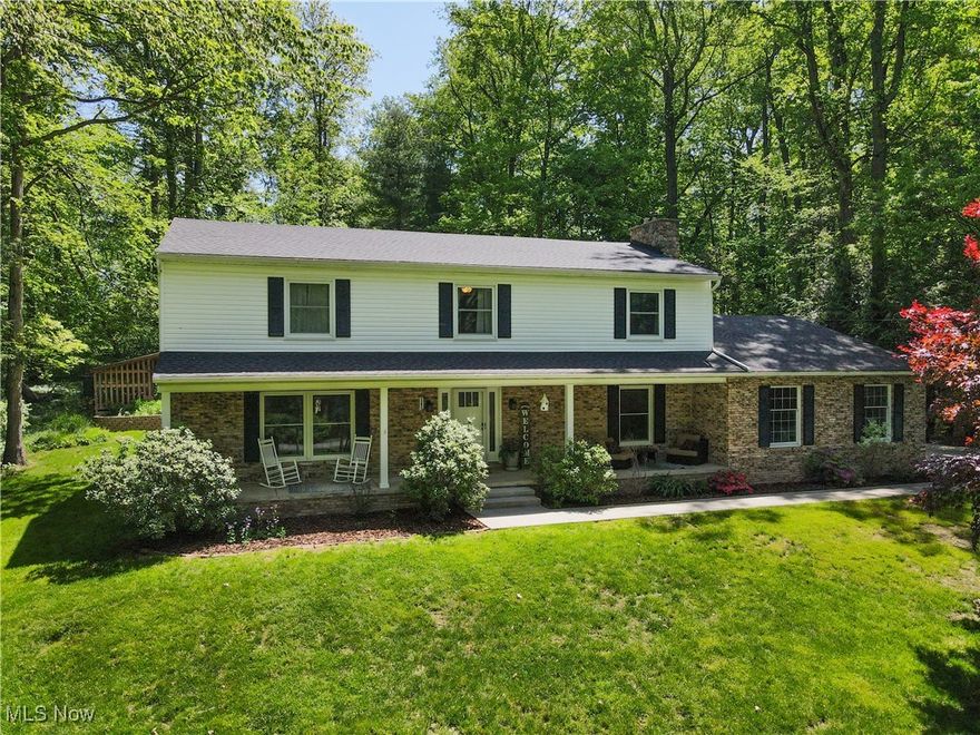 Stunning, completely renovated 5-bedroom Colonial w in-law suite, tons of privacy & 3 car garage on a cul-de-sac in the award-winning Revere School District! From the moment you enter this home, you're surrounded by updates, improvements + chic style. Whether it’s the refinished hardwood (HW) floors, new front door w side panels, upd lighting, fresh paint, or the new windows throughout, around every corner is a surprise. The “Choose Your Own Adventure” foyer provides entrance to Family Room, Hearth Room, Kitchen, and second floor. Family Room feats huge picture window, in-wall speakers, overhead lighting, plush carpet & opens to the Dining Room w new paint, classic wainscotting & chair rail. Hearth Room feats WB insert, HW floors & opens to updated ½ bath, laundry, garage drop zone & 6th bedroom or home office. Completely remodeled Kitchen is an entertainer’s & chef’s dream: Maple cabinetry, large center island w seating, 36 in gas range, pot filler, walk in pantry, double oven, farmhouse sink, tons of natural light, large adjacent dining area, and slider to private, back patio w terraced gardens & mature landscaping. As if all this isn’t enough, the nearby first floor in-law suite is perfect for that friend from out of town or that one long term guest you just can’t say no to: Incls living room, slider to outside, kitchenette, large bedroom, ADA bathroom w roll in shower & access to private garage. Second floor feats refinished HW floors & spacious Master Bedroom w renovated bath w dual sink vanity, heated floors & WIC. Three more generously sized bedrooms, renovated bathroom & storage closets complete the second floor. Still looking for more? Other notable updates include: 200 amp elec service, radon system, hot water tank (24), furnace (21), AC (21), gutters (20), roofs on garage & front half (20) to name a few. Sitting on 1.5 acres & with over 3400 sq ft of living space, this home is sure to become the “Place to Be” for all of your loved ones.