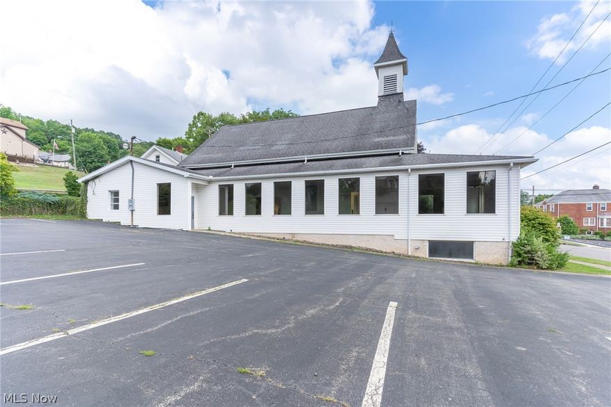 In close proximity to all of downtown Lowellville,  44 E Wood St. is beaming with potential. Previously a church, this historic building has been updated at various times and provides an excellent setup for community centers, religious services, banquet halls or whatever your goals are. If you need a large building with a large parking lot, look no further than this unique opportunity!