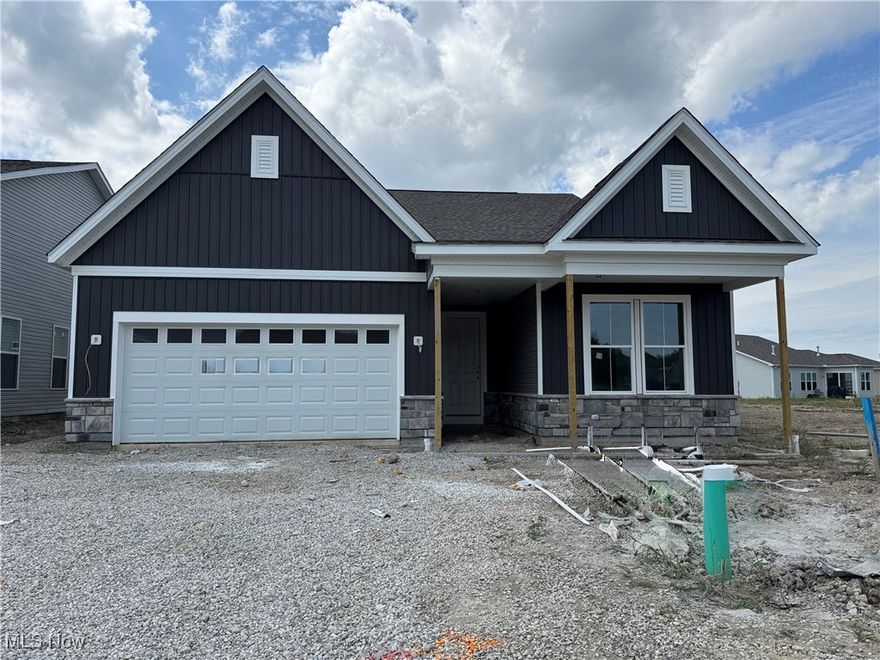Why wait to build when this stunning, turn-key ranch is ready for you now—beautifully landscaped, and packed with upgrades on a spacious homesite! This ranch-style new home offers the perfect blend of luxury, comfort, and convenience.  The gathering room, with a cozy fireplace, sets the tone for warm gatherings and relaxed evenings. The open layout flows seamlessly into a chef-inspired kitchen featuring a large island, built-in gas range, and premium finishes that make entertaining effortless. The main-level owner’s suite is a true sanctuary, complete with 2 walk-in closets, a double vanity, and a spa-like shower. Your guests will feel right at home in the private ensuite, which includes a walk-in closet and full bath. Need a quiet space to work or create? The flex room offers the perfect escape for productivity or inspiration. Upstairs is a spacious loft, bedroom, and bathroom that expands your living space and lifestyle options. The extended 2-car garage offers extra room for hobbies, or storage for maximum flexibility. Whether you're entertaining or unwinding, the rear covered patio is a true extension of your home. Take advantage of our below market rate special financing, designed to make this luxury home more affordable than ever. With very limited opportunities to own a Ranch style home in Avon Lake, this is THE home for you! Call today to schedule a tour and experience the ease and elegance of luxury turn-key living at Port West.