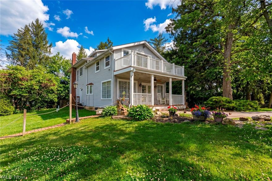 (Full video available) Be prepared to be inspired-your new life awaits at this one-of-a-kind, private luxury country estate in highly desirable Hinckley. Nestled on a serene/lightly treed 2.39-acre setting overlooking a neighbouring tranquil pond, captivating property blends historic charm w/modern updates/offers unmatched versatility. Heart of the estate is an extraordinary 6,000+ sq ft Gambrel-roof barn w/multiple levels of climate-controlled space-perfect for entertaining, events, weddings, or a variety of creative uses. Barn includes horse stalls, tack room, access to pasture for grazing/exercise. Charming former milk house features finished living space plus a private, heated/cooled office. Separate 5-car garage w/fresh concrete drive provides ample storage/functionality. Main residence is a warm and inviting country home offering 3 bedrooms/3 full baths, w/spacious, updated eat-in kitchen showcasing large picture windows to capture the scenic views. First floor features custom solid hardwood flooring throughout & convenient first-floor laundry. Outdoor living is exceptional w/large covered porch off the kitchen, multiple decks, private 2nd floor balcony off the owner’s suite-perfect for relaxing and enjoying the expansive views. Extensive updates include kitchen appliances (2025), furnace (2022), electrical/plumbing (2008), full home transformation in 2008. Barn has seen major improvements 2013–2023 including A/C (2022), metal roofs, copper gutters, & multiple garage doors. This Century estate is set far back from the road for ultimate privacy, yet minutes to I-71, I-80, shopping, dining, Metroparks. Public water & sewer. Additional adjoining 6.3795-acre parcel with pond available. Endless possibilities at an affordable price.
