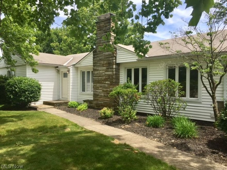 This attractive, well-kept ranch on almost an acre has so many terrific features it's hard to know where to start. Completely updated kitchen with granite counter tops, brand new stainless steel appliances (including gas stove), stainless steel double sink with new faucet and pantry. Oversized first floor laundry/mud room with half bath. Newly refinished hardwood floors throughout the first floor including all 3 bedrooms that have double closets, tons of natural  light and a cedar walk-in hall closet. The spacious living room has a stone fireplace and is open to the dining room. New garage floor with drain, keypad entry and remotes is rear entry increasing the front curb appeal while overlooking the park like backyard. Waterproofed full basement with fireplace can be finished to double your common area space. Perfectly located between Cleveland & Akron, Brecksville has everything (Cleveland Metroparks, award winning Brecksville-Broadview Heights schools, the City of Brecksville's exten