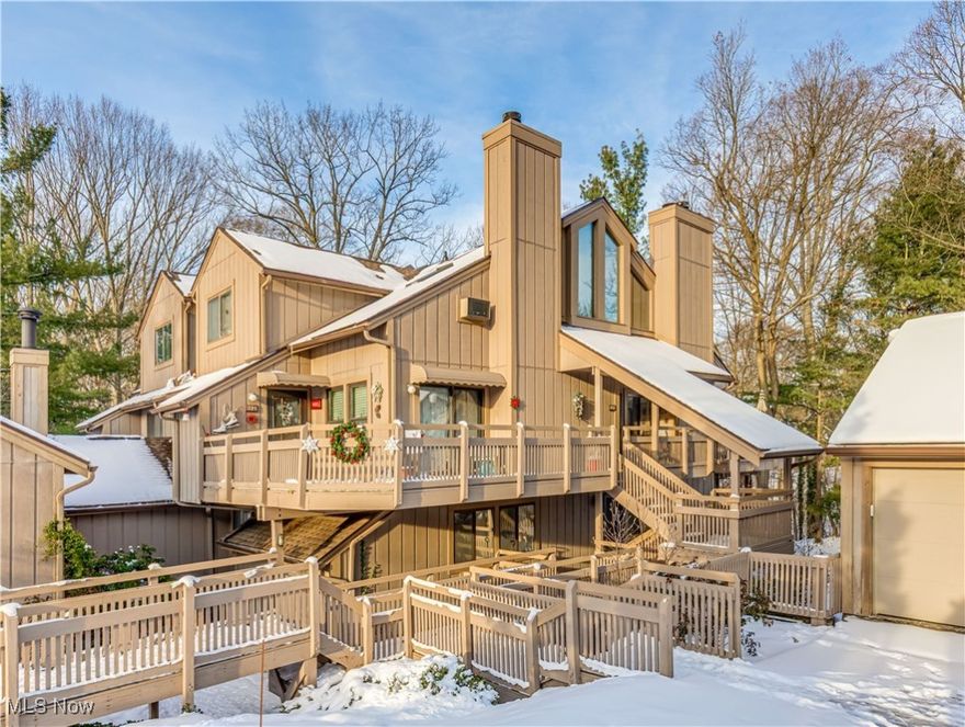 Nestled among the trees, this updated condo features two bedrooms, 2 full bathrooms , and gorgeous wooded views! Main level boasts an open-concept living area with vaulted ceilings and an airy feel. The living room includes a gas fireplace, perfect for those cooler nights. A large sliding door provides access to the wrap around deck, perfect for cooking out, entertaining and relaxing! The fully equipped kitchen includes breakfast bar, pantry, gas range, dishwasher, microwave and new stainless fridge. The first floor bedroom boasts a large closet and is located next to the fully remodeled bathroom including updated shower, vanity, tile flooring and fixtures!  Second level features include a large loft with huge windows and vaulted ceilings. A sizable owners suite with ample storage, multiple closets and ensuite with soaking tub, tile floors and shower! This spacious level is completed with laundry space, washer and dryer stay! This home in one of very few with central air and offers easy access to the detached garage and grounds! Come and enjoy a maintenance free lifestyle with access to community pool just moments away, ideal for unwinding during those summer days. Located near Merriman Valley and Cuyahoga Valley National Park, with quick access to Routes 8 and 77, shopping, dining, and entertainment options are just minutes away.