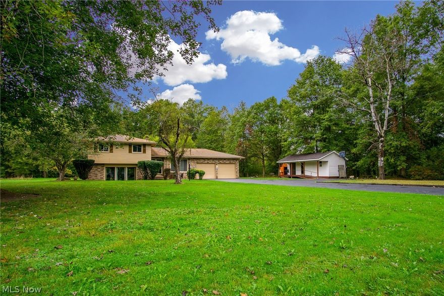 Beautiful home boasting 4 bedrooms and 2 baths on over 1 acre of land! The interior features a humongous first level updated master bedroom with full bath, second level bedroom with wood floors and a very modern living room.  The most recents updates are the roof, HWT, exterior paint, and furnace. Other updates includes new windows, Ohio State Waterproofing, water softener, and kitchen. The exterior includes a extra building that was perviously being used as a office. The possibilities are truly endless for this one of kind unique feature. In addition to the extra building on the lot you will have a ton of land to enjoy!