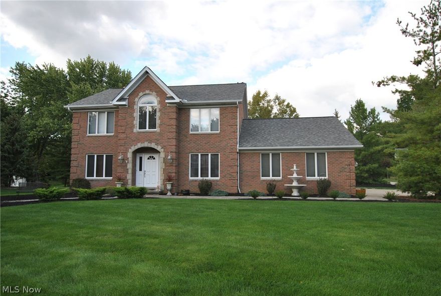 All brick colonial w/4 bedrooms, 3 full and 1 half bathrooms. Newer roof, furnace, A/C, hot water tank. Updated kitchen w/granite counters, newer kitchen floor.  Family room w/newer flooring. Finished lower level w/Great room and bar area. Irrigation system. Wooded half an acre lot. Prime location. A True Must See!