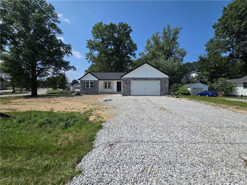 New Construction almost complete in Stow Ohio. Custom quality Built ranch home with open floor plan situated on approx 0.5 acre lot featuring 3 bedrooms,2 baths,2 car garage with 8'H garage door. Full basement plumbed for a 3rd bathroom. Main level laundry .Rear raised concrete patio. Kitchen Appliances included with granite countertops and island perfect for entertaining. Vinyl Plank Flooring in main living area. Must see to appreciate. Builder Warranty included and no H.O.A fees.
