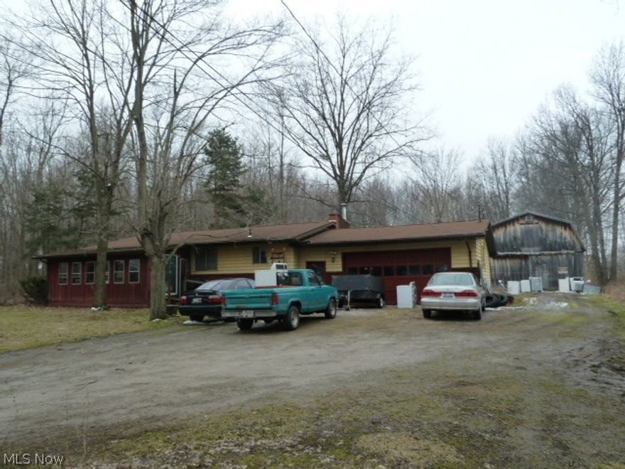 Country living close to city amenities.  This 3 bedroom ranch with attached garage features original hardwood floors, dining room,  full, partially finished basement with full bath, lots of storage, and 24 x 32 two story storage barn.  .82 acre lot.  Enclosed front porch.  Needs some TLC and updating, but could be a great home.