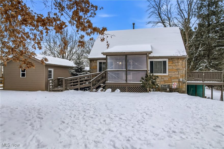 Charming Cape Cod nestled on nearly an acre in Canfield Township! Enjoy a peaceful, tree-lined setting with the convenience of nearby shopping and restaurants, plus easy access to many metropolitan parks and the county fairgrounds.

The home is easily accessible from the driveway, with a 1½-car garage and a welcoming covered front porch. The true highlight of this property is its location — the street dead-ends into a nature preserve and bird sanctuary, offering privacy and incredible natural beauty right outside your door.

Step inside to find beautiful hardwood floors throughout, all-new windows, and updated lighting that brightens every room. The kitchen is warm and inviting, featuring LVT flooring, recessed lighting, and plenty of cabinet space for all your cooking essentials.

The spacious living and dining rooms provide an ideal layout for relaxing or entertaining. From the dining area, step out to the large deck overlooking a peaceful, wooded view — the perfect spot to unwind and enjoy nature.

Both bedrooms offer nice-sized closets and the full bath includes a newer walk-in tub/shower combo. Electrical and plumbing updates add peace of mind for the next owner. 
This 2-bedroom home is full of character and thoughtful updates. Don’t wait — schedule your private showing today!