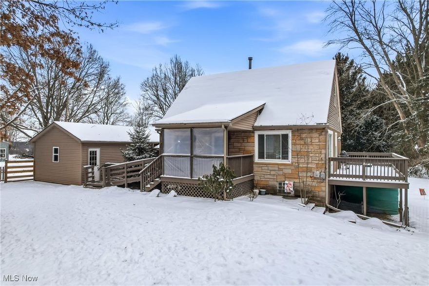 Charming Cape Cod nestled on nearly an acre in Canfield Township! Enjoy a peaceful, tree-lined setting with the convenience of nearby shopping and restaurants, plus easy access to many metropolitan parks and the county fairgrounds.

The home is easily accessible from the driveway, with a 1½-car garage and a welcoming covered front porch. The true highlight of this property is its location — the street dead-ends into a nature preserve and bird sanctuary, offering privacy and incredible natural beauty right outside your door.

Step inside to find beautiful hardwood floors throughout, all-new windows, and updated lighting that brightens every room. The kitchen is warm and inviting, featuring LVT flooring, recessed lighting, and plenty of cabinet space for all your cooking essentials.

The spacious living and dining rooms provide an ideal layout for relaxing or entertaining. From the dining area, step out to the large deck overlooking a peaceful, wooded view — the perfect spot to unwind and enjoy nature.

Both bedrooms offer nice-sized closets and the full bath includes a newer walk-in tub/shower combo. Electrical and plumbing updates add peace of mind for the next owner. 
This 2-bedroom home is full of character and thoughtful updates. Don’t wait — schedule your private showing today!