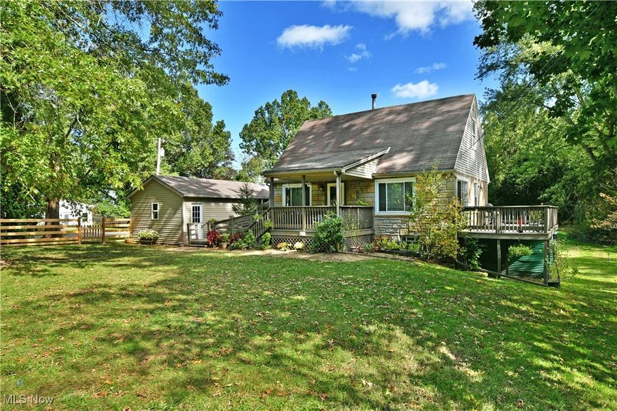 Charming Cape Cod nestled on nearly an acre in Canfield Township! Enjoy a peaceful, tree-lined setting with the convenience of nearby shopping and restaurants, plus easy access to many metropolitan parks and the county fairgrounds.

The home is easily accessible from the driveway, with a 1½-car garage and a welcoming covered front porch. The true highlight of this property is its location — the street dead-ends into a nature preserve and bird sanctuary, offering privacy and incredible natural beauty right outside your door.

Step inside to find beautiful hardwood floors throughout, all-new windows, and updated lighting that brightens every room. The kitchen is warm and inviting, featuring LVT flooring, recessed lighting, and plenty of cabinet space for all your cooking essentials.

The spacious living and dining rooms provide an ideal layout for relaxing or entertaining. From the dining area, step out to the large deck overlooking a peaceful, wooded view — the perfect spot to unwind and enjoy nature.

Both bedrooms offer nice-sized closets and the full bath includes a newer walk-in tub/shower combo. Electrical and plumbing updates add peace of mind for the next owner. 
This 2-bedroom home is full of character and thoughtful updates. Don’t wait — schedule your private showing today!