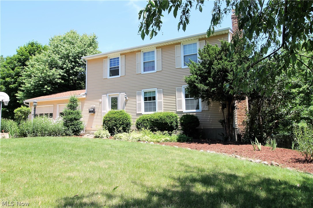 Welcome to the tranquil views of the water from this four bedroom, three full and half bath Colonial home. Come on into the inviting foyer to the living room offering a brick fireplace with built in wood storage, mantle and is open to the dining area and kitchen. The large, stunning, kitchen offers an abundance of cabinets and counter space, built in desk, stove/oven, refrigerator, dishwasher, and dining area. The family room has a slider door to the fabulous two tiered deck to enjoy entertaining, grilling out or just relaxing with spectacular views of the water and the gorgeous backyard. There is a half bathroom and laundry room to finish the main level. Upstairs you will find four large bedrooms and two full bathrooms. One of the bedrooms is the master suite which has a full bathroom that offers a beautiful bowl sink. The lower level offers a slider door to the backyard and a full bathroom, workshop, plenty of room for storage etc. There is a two car attached garage that offers a gas