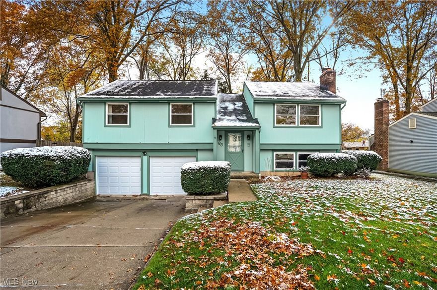 Beautiful Bi-Level Home!  This lovely home features an open living and dining room combination with sliders leading to a large deck overlooking a spacious, flat, fenced-in backyard—perfect for relaxing or entertaining. The eat-in kitchen offers plenty of cabinet and counter space, along with newer stainless-steel appliances.  You will also find three comfortable bedrooms with ample closet space, including a primary suite with private full bath and walk in shower.  The lower-level family room is warm and inviting, highlighted by a beautiful gas fireplace—ideal for cozy winter evenings. The updated half bath (October 2025) and brand-new carpeting throughout (November 2025) make this home move-in ready. Additional highlights include a good-sized two-car garage with plenty of storage and a shed.  Other updates include new garage doors - October, 2025, Hot water tank and kitchen flooring - 2023.  Windows come with a lifetime transferrable warranty.  Home warranty being offered by the seller.