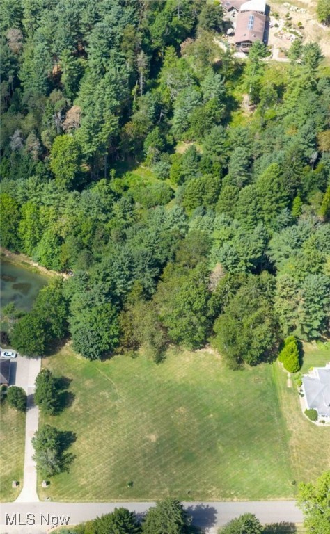 Beautiful country setting, just outside of town. 1.5+/- acre level lot with 150' frontage. Surrounded by prestigious homes. Private, wooded rear lot. New Philadelphia City School district. Lot can not sell before adjoining home. See mls#5153307