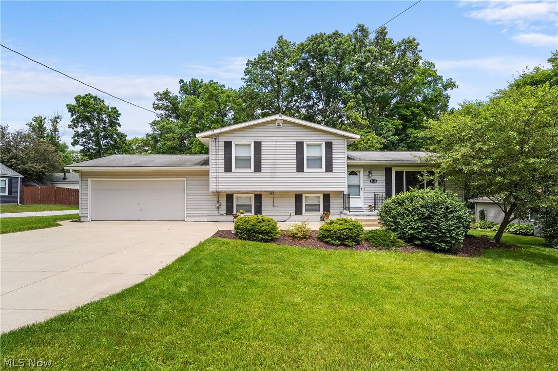 Looking for a spacious home with a lot of options for space? You just found it! Three bedroom, 1.5 bath split in Stow is ready for it's next owner. The living room and dining room combination with slider to the 3 season sunroom/enclosed porch will be super for entertaining. The eat-in kitchen offers nice cabinet and counterspace to include a convenient pantry and all appliances. All bedrooms feature ceiling fans and ample closet space. The recreation room, half bath and bonus/office area complete the lower level and then find another finished room in the waterproofed basement. The large backyard is wooded and there's plenty of room to relax and enjoy. You will love the oversized 2 car attached garage and extra parking in the driveway. Updates include: Glass block windows in basement - 2023, Waterproofed basement by Ohio State Waterproofing to include sump pump with battery backup - 2022, Furnace and AC - 2020, Refrigerator - 2019, Dishwasher - 2018, Stove - 2016. Close to shopping, dining and Route 8.