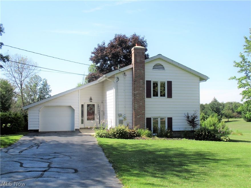 Golf course views in this unique 3-bedroom, 2-full bath home.  Style could be considered a raised ranch with a full finished walk-out basement or a bi-level with a walk out basement.  Either way this one has some character and a great sized home.  Main floor features a large living room with space for your dining table.  Eat-in kitchen could have a breakfast table.  Master bedroom with master bath.  Bath/shower has a newer surround by Bath Fitters. Master has two large closets and sink/make-up area outside of the bathroom. Ground level full bath with shower/laundry room.  Lower level has 2- more bedrooms with good sized closets. Family room with slider to a gorgeous 17 x 11 patio enclosure (not included in the sq. ft) with concrete patio area and paver retaining wall. Lots of bonuses to this home included central air conditioning, hot water gas heat, security system, 1-car attached double deep heated garage (12 x 28) w/ overhead door opener and a 2nd garage 16 x 16 with concrete floor,