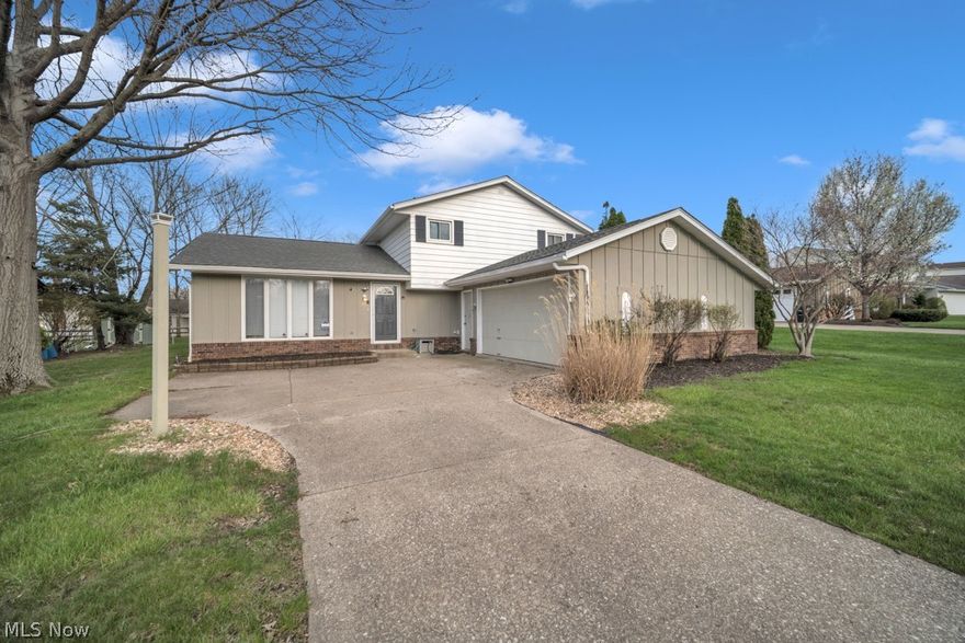 Welcome to this spacious and inviting 4-bedroom home offering 1,795 square feet of comfortable living space! Built in 1977, this home features an open, bright, and airy floor plan designed for modern living. The living room boasts high ceilings, creating an impressive space filled with natural light.

The kitchen includes a convenient breakfast bar that overlooks the family room?perfect for everyday living and entertaining. Just off the family room, you'll find a versatile fourth bedroom ideal for a home office, guest room, or hobby space, along with a conveniently located laundry area and half bath.

Upstairs, three additional bedrooms provide privacy and ample space. The home's flexible layout and generous living areas make it ideal for a variety of lifestyles.

Nestled just off Boston Road on a private lot, this property offers a peaceful setting on a quiet cul-de-sac street. Enjoy the outdoor space from the deck, perfect for relaxing or entertaining. Conveniently located near shopping, dining, and local amenities, this home is ready for its next owner!