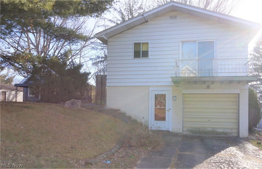 Three bedroom raised ranch with hardwood floors. Updated bathroom. Living room has a slider to the deck. Large eat-in kitchen. Lower walk out level features a nice family room with a wood burning fireplace, laundry room with a ceramic floor and storage closet, plus a separate unfinished side with lots of storage and shelving. Furnace and A/C updated in 2012. Freshly painted living room. Park nearby. Property is sold As-Is.