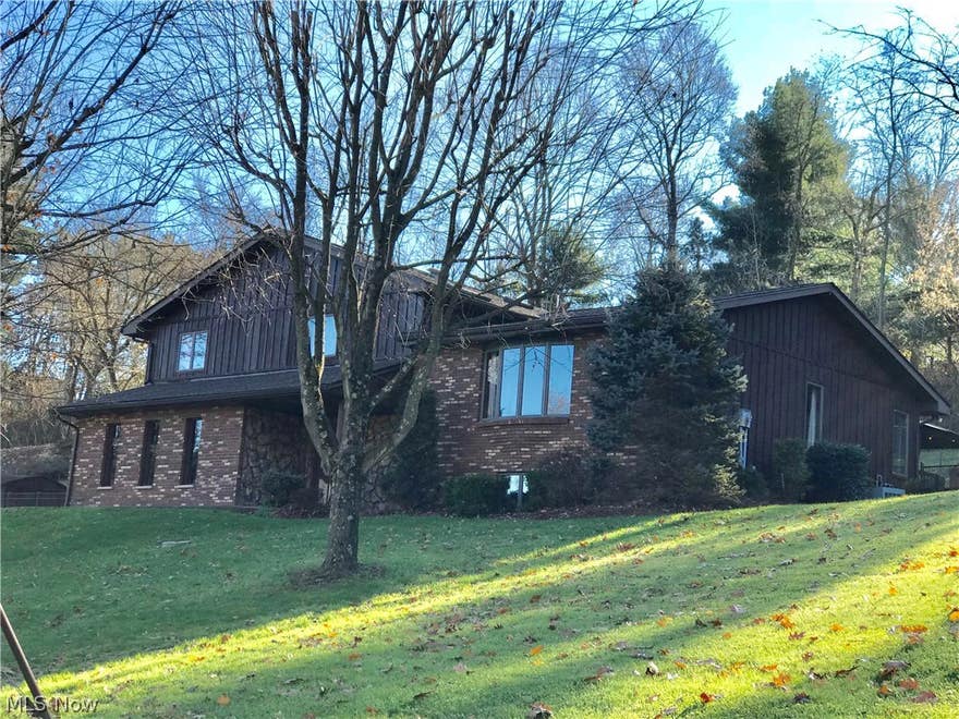 Great tri level home on almost an acre. Located just outside the city, this property has a country feel but close to everything. You can get to  wheeling or Saint Clairsville in less than 15 min. With two extra large living spaces up and down, there is room for everyone! With 2900 square feet finished living space you will have room to roam. The 4th  bedroom is on the first level but could be used as anything. The extra large master bedroom has a nice master bath complete with a large jetted tub. The main bathroom also has a jetted tub. The kitchen opens up to the massive deck area which is partly covered. On the first level is also what this owner used as a gun room. This room could be used for a multitude  of purposes. The wood is beautiful on the ceiling, walls and floor. The huge living room has a large bay window that brings the outside in.  A vaulted ceiling adds to openness and light feeling of the living room.  Entertaining family is fun and relaxing with the fenced in in ground pool. A family home to enjoy for years to come! (Agents... see broker​​‌​​​​‌​‌​​​‌‌​​​‌‌‌​​‌​​‌‌​​​​ remarks)