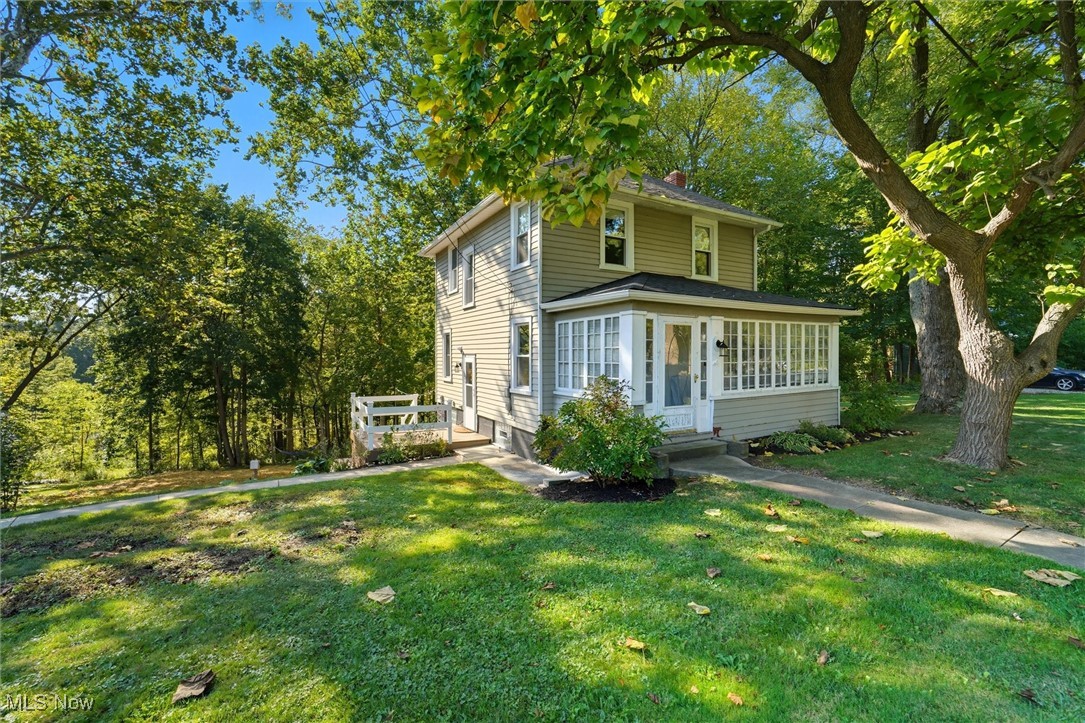Charming 3 bedroom 1 bath Colonial with wooded views situated on 1.528 acres! This home features an updated kitchen and full bath, as well as a formal dinning room with built in features. A large living room boasts built-in shelving and plenty of windows to let in natural light & a front porch. The upstairs offers 3 bedrooms and an updated full bath & a walk-up attic accessible from one of the bedrooms. The full unfinished, walkout basement, leads out to a spacious deck over looking a beautiful wooded lot for your entertaining pleasures! Many updates have been completed in this home including a new septic system, a new hot water heater, new windows, updated electrical box & wiring! There is a new 10 x 16 storage building as well!